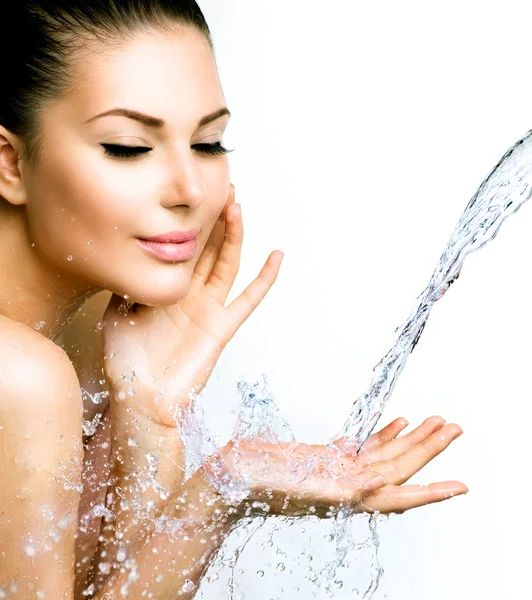 Woman with splashes of water — Stock Photo, Image