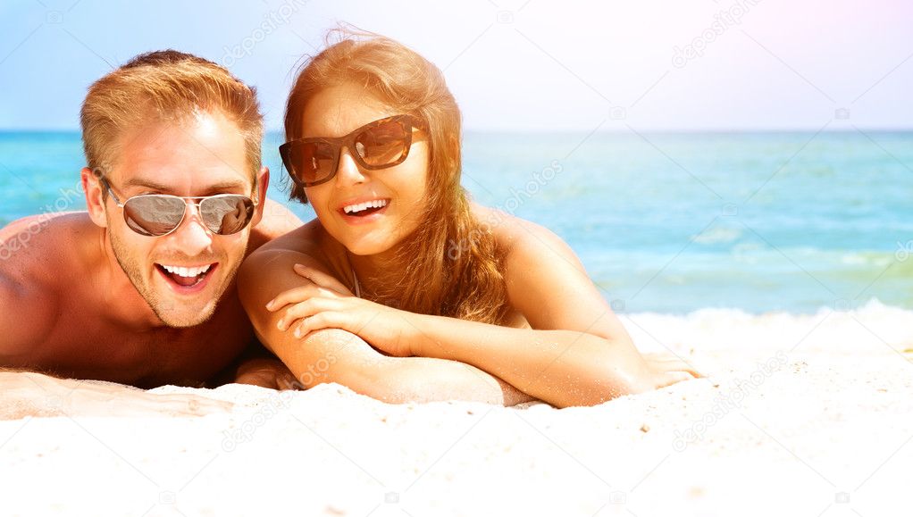 Couple in Sunglasses  on the Beach.