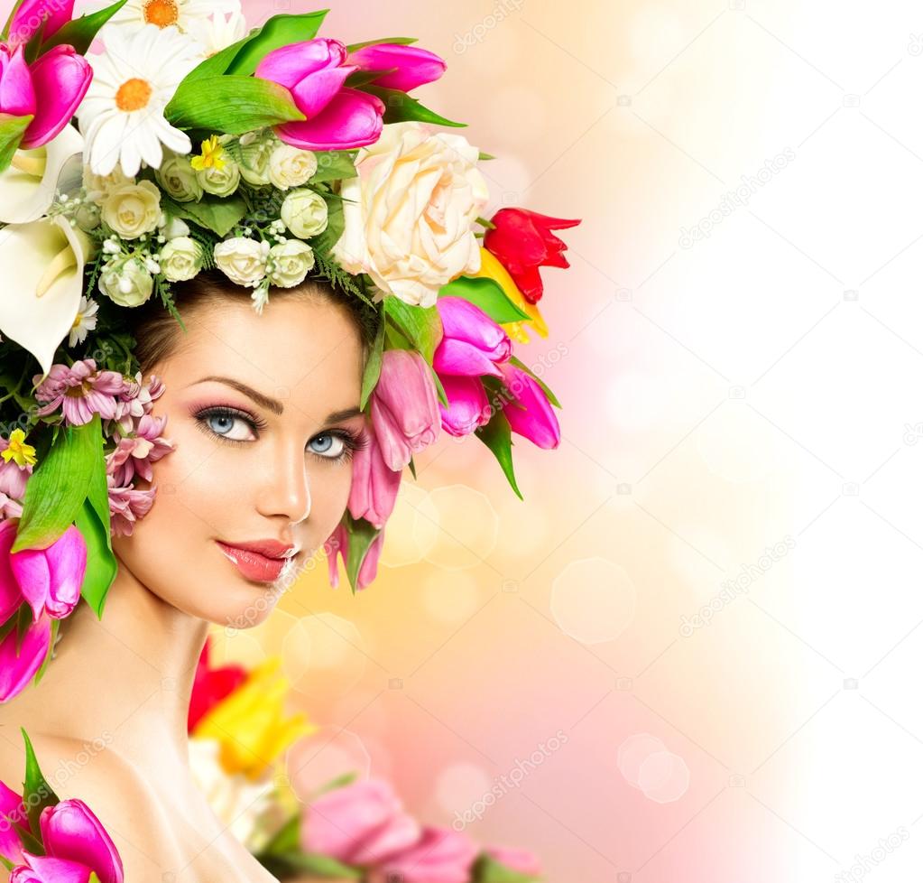 Model girl with colorful flowers hairstyle