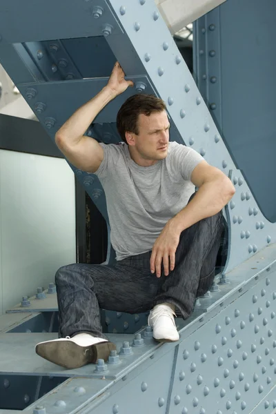 Portrait of the man in an industrial background — Stock Photo, Image