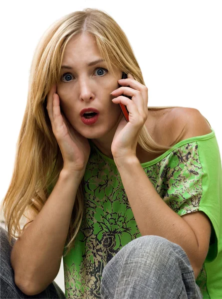 The young beauty is surprised with news in a phone conversation — Stock Photo, Image