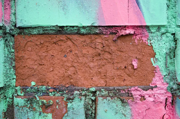 Fragment of the old wall with colorful splashes of paint — Stock Photo, Image