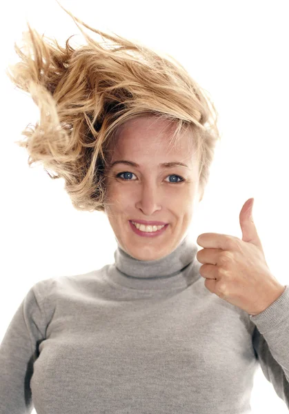 Smiling woman giving thumbs up for approval — Stock Photo, Image