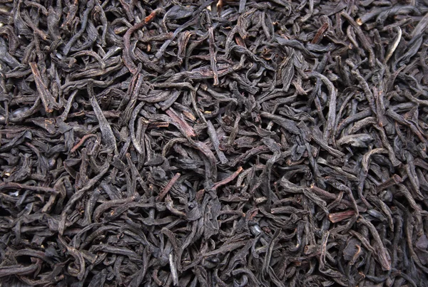 Feuilles noires fond de thé, texture des ingrédients alimentaires — Photo