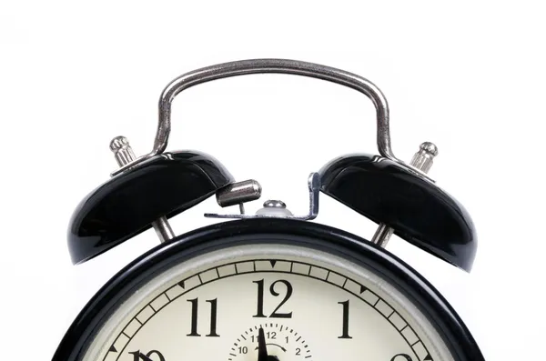 A classic old black alarm clock on white background — Stock Photo, Image