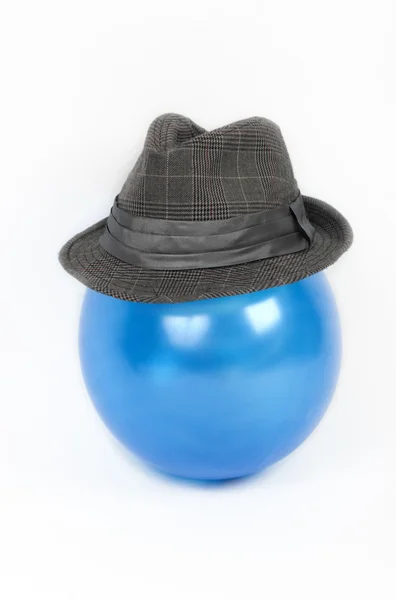 Man's hat on a blue sphere — Stock Photo, Image