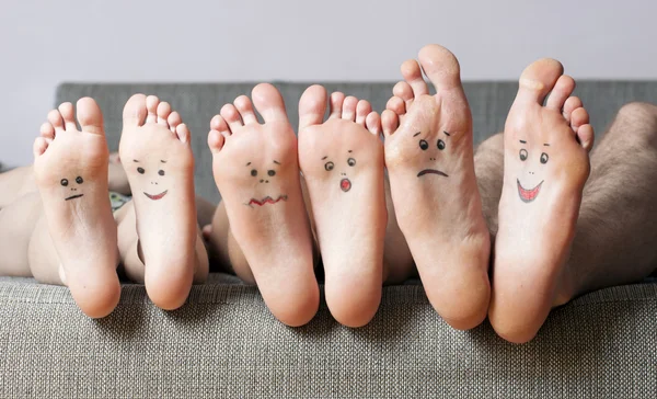 Close up of human soles with smiles — Stock Photo, Image