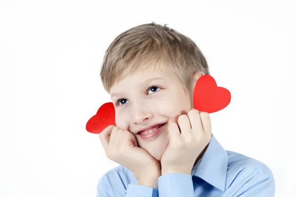 Lachende jongen met rode harten. — Stockfoto