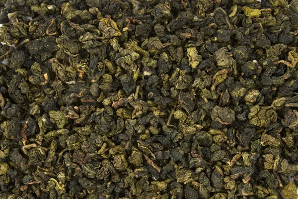 Zöld levelek teát háttérben — Stock Fotó