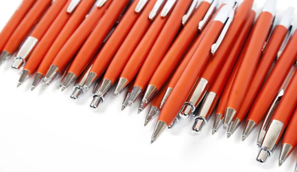 Many orange pens — Stok fotoğraf