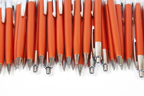 Many orange pens — Stok fotoğraf