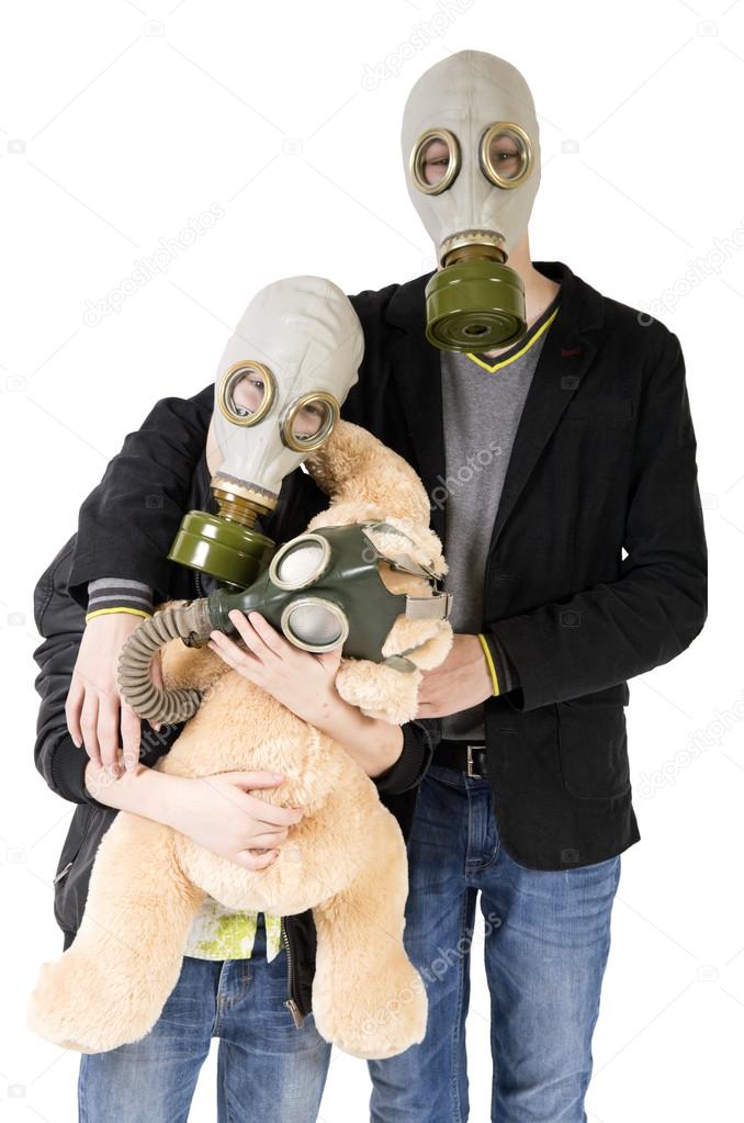 Children with toy in gas mask