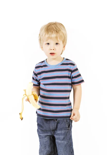 Child eats banana — Stock Photo, Image