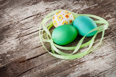 Easter eggs on wood background