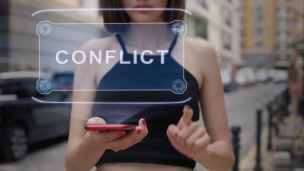 Young adult interacts hologram Conflict — Stock Video