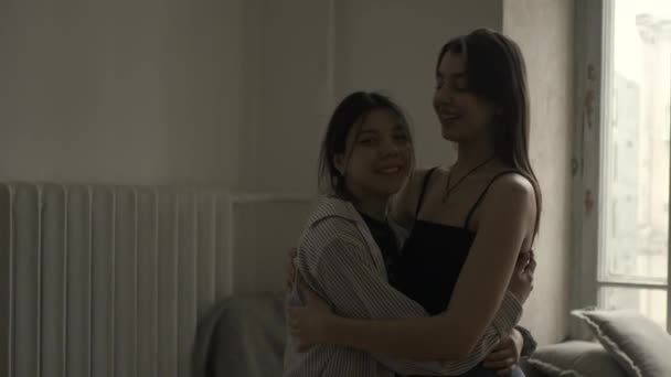 Women hug each other — Stockvideo