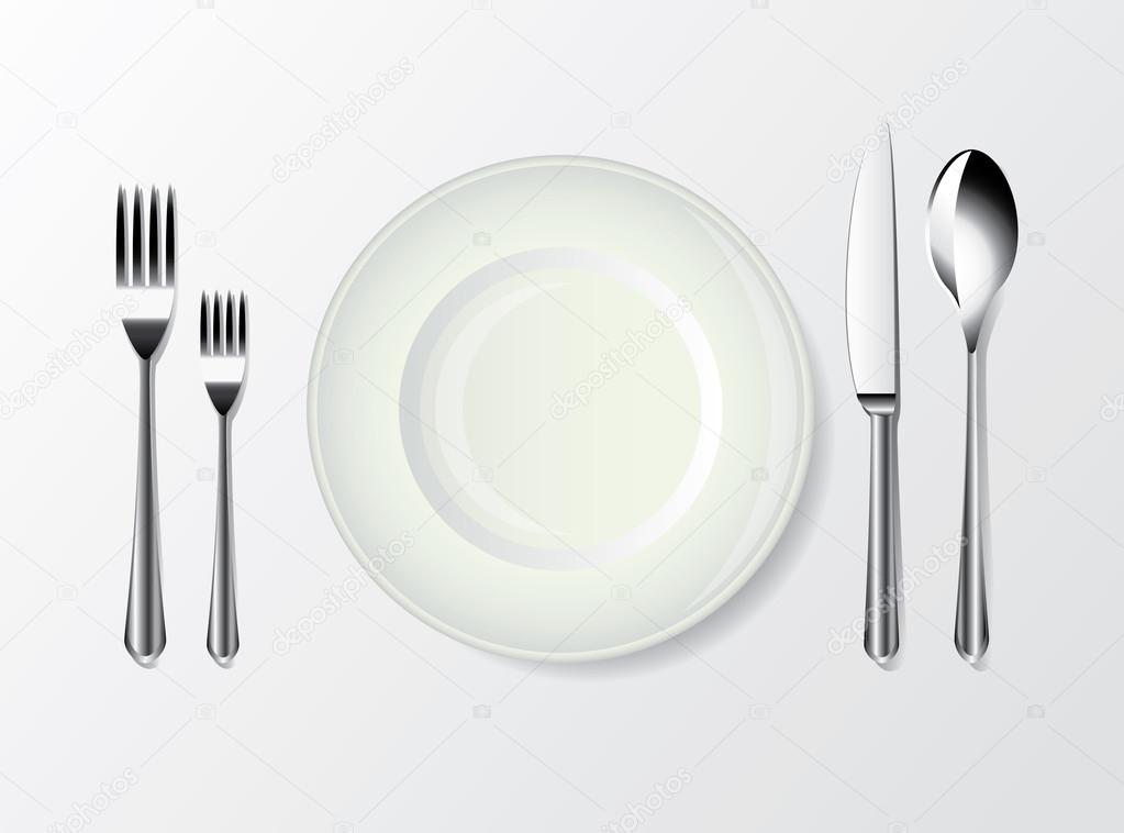 White plate, spoon, fork and knife