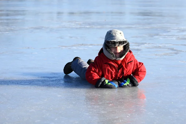 The boy fall down on the ice — Stock Photo, Image