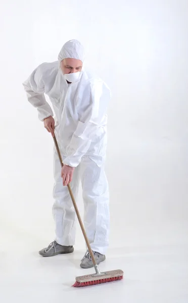 Worker sweeping the floor — Stock Photo, Image