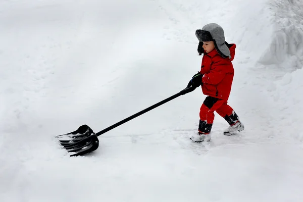 Menino pá neve — Fotografia de Stock