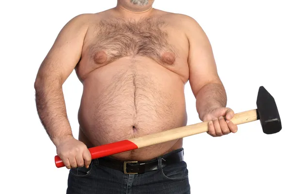Strong fat man holding a big hammer — Stock Photo, Image