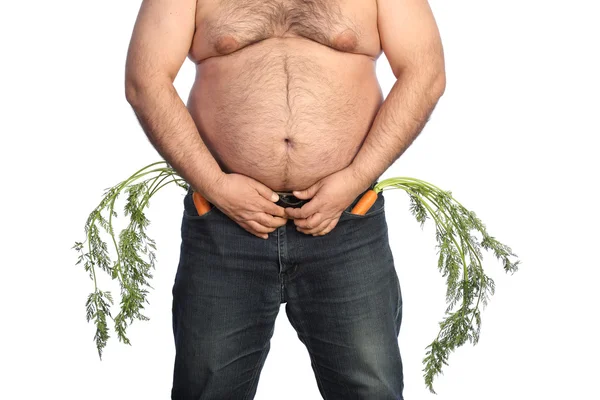 Толстяк держит морковку. — стоковое фото