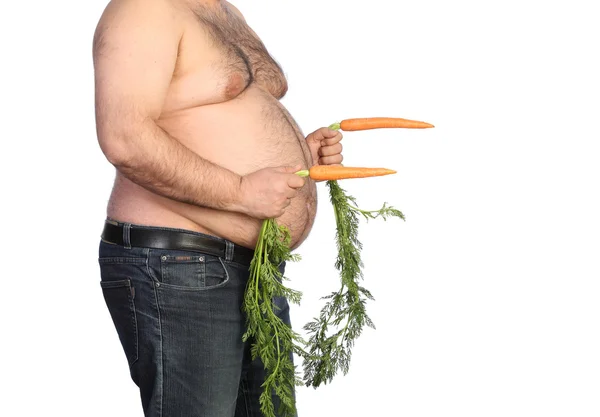 Gordo segurando cenoura — Fotografia de Stock