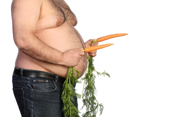 Gordo segurando cenoura — Fotografia de Stock