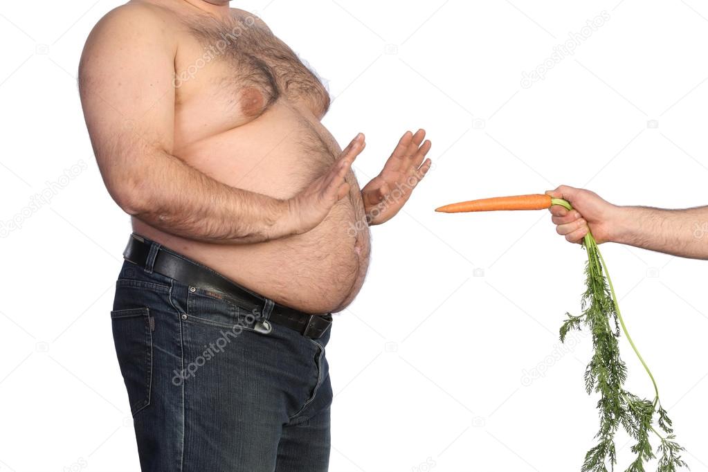 Fat man holding carrot