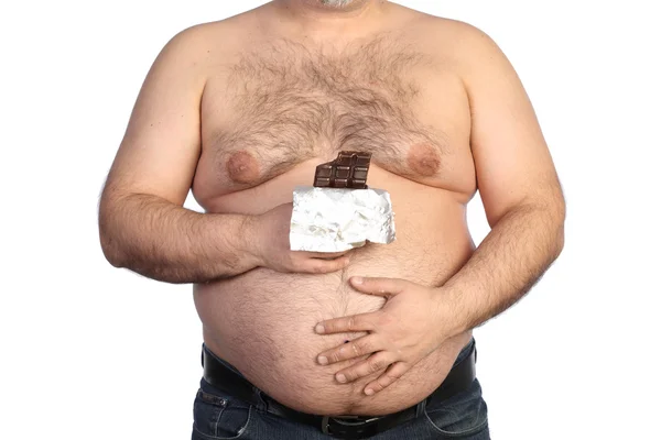Толстяк держит шоколад — стоковое фото