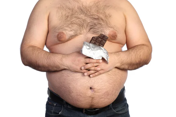 Толстяк держит шоколад — стоковое фото