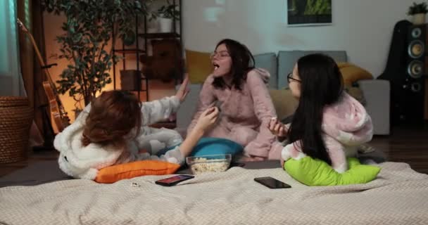 Female Friends Having Fun Together At Home Party. Yonung woman in funny onesies at pajama party. — Stock Video