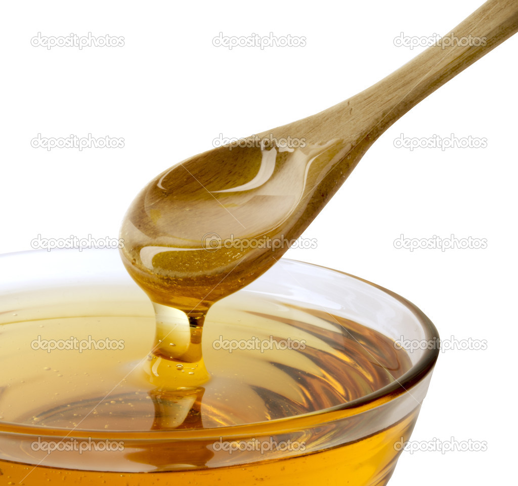 Honey and spoon — Stock Photo © quka 23365790