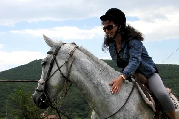 Woman on horse — Stock Photo, Image