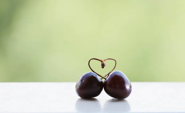 Concept Pair Cherries Hanging Clothespin Water Splashed — Stock Photo, Image