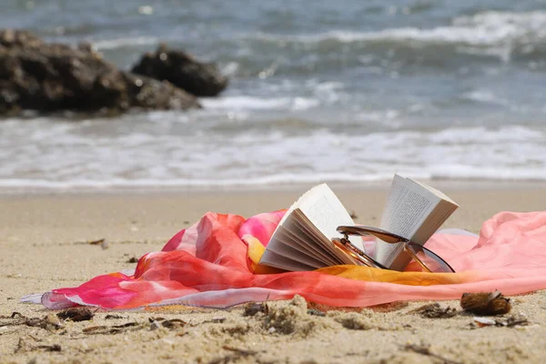 Summertime Concept Colorful Scarf Opened Book Sunglasses Beach Sea Waves — Stockfoto