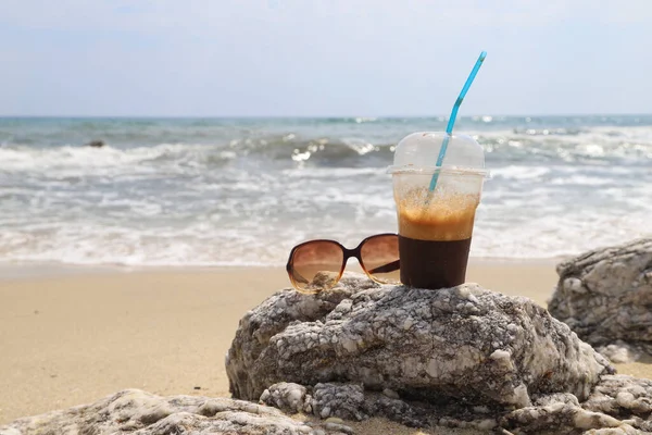 Summertime Concept Plastic Cup Frappe Sunglasses Beach Sea Waves Background — Stockfoto