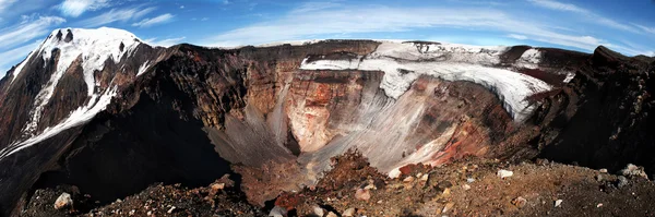 Volcano crater with mountain covered with snow on the background — Stock Photo, Image