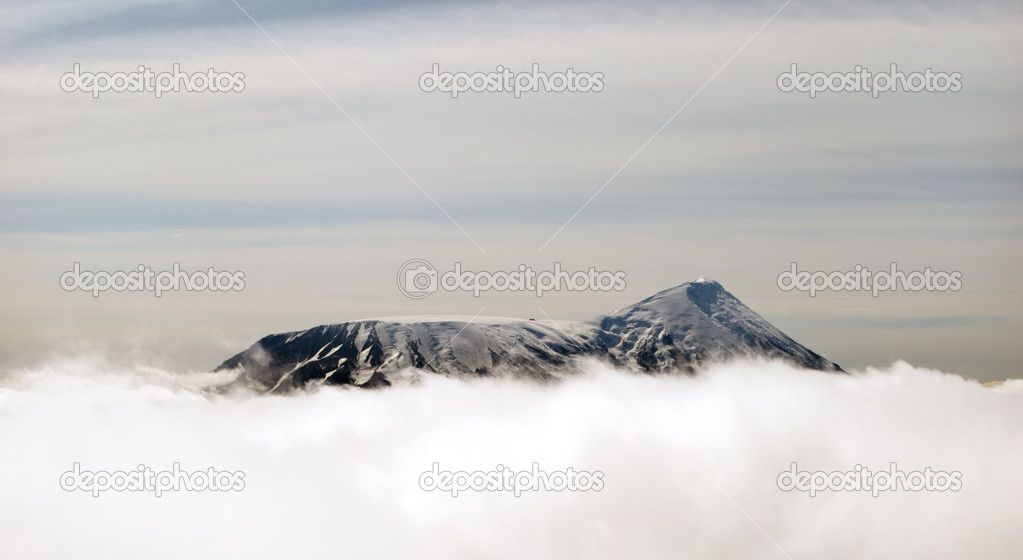 peaks of mountains above the clouds, Russia, Kamchatka