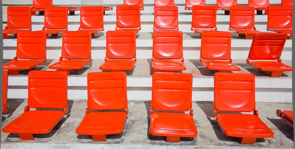 Empty red stadium seats at hockey field. — Stock Photo, Image