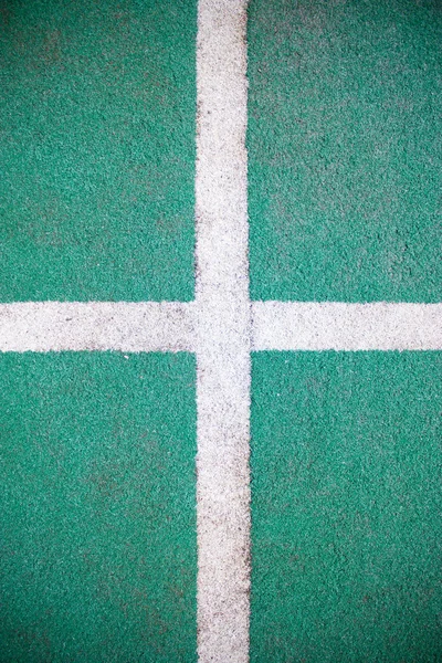 Grama falsa e linha branca como fundo . — Fotografia de Stock