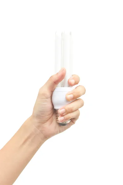 Mão holdind lâmpada fluorescente de poupança de energia isolada em branco ba — Fotografia de Stock