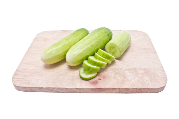 Cucumbers and slices on chopping block isolated on white backgro — Stock Photo, Image