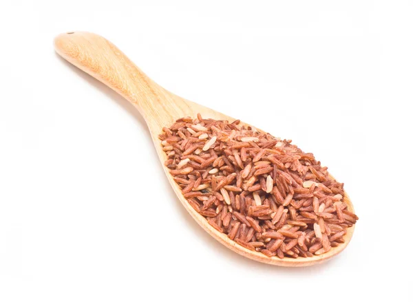 Brown rice with wooden spoon isolated on white background. — Stock Photo, Image