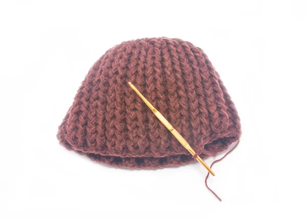 Brown crochet hat with golden hook isolated on white background. — Stock Photo, Image