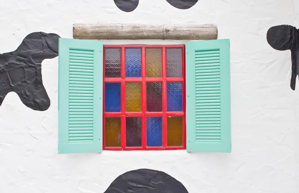 Colorful window with camouflage wall. — Stock Photo, Image