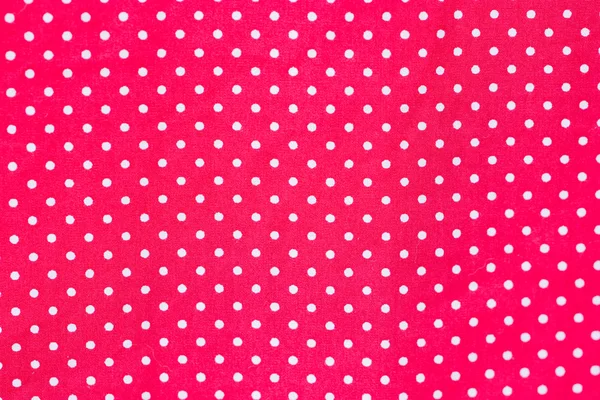 Witte polka dots op rode stof. — Stockfoto