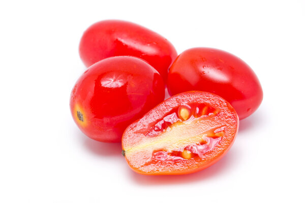 Grape or cherry tomatoes isolated on white background.