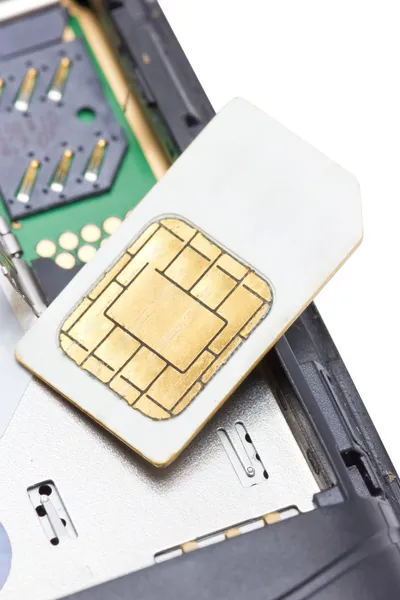 Primer plano del teléfono celular y la tarjeta SIM . — Foto de Stock