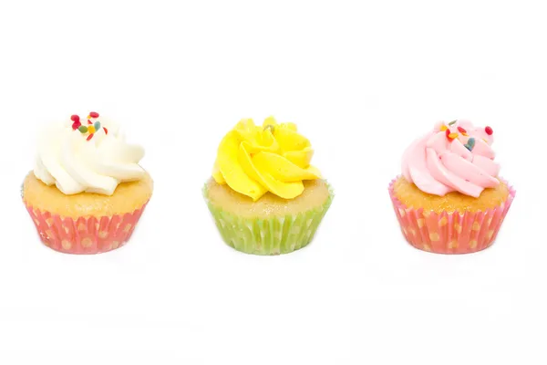 Cupcakes com polvilhas isoladas sobre fundo branco . — Fotografia de Stock